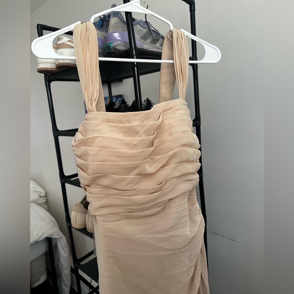 Never worn champagne gown.